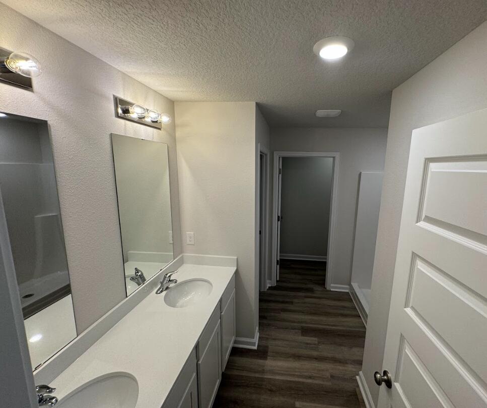 537 Mary Lou Way Crestview, FL 32539 - Photo 9 of 10 a bathroom with a sink and mirror with bathtub