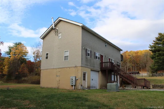 a front view of house with a garden
