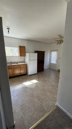 a bathroom with a granite countertop bathtub shower sink and toilet
