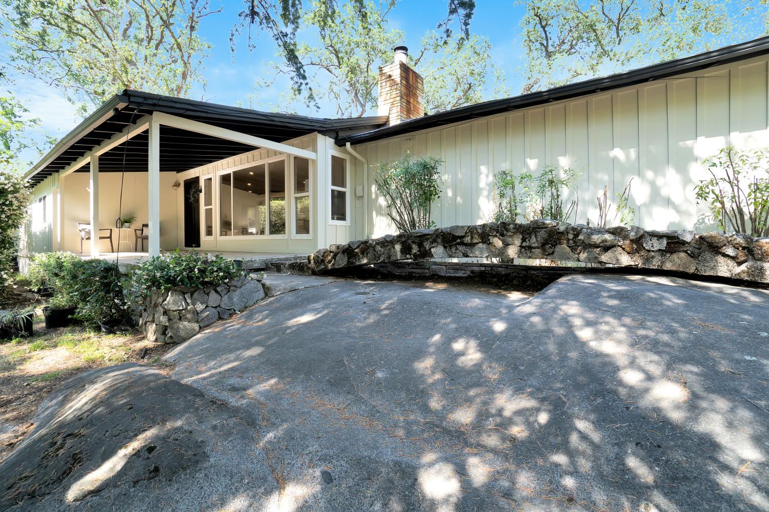 6299 Horseshoe Bar Road Loomis, CA 95650 - Photo 31 of 43 a front view of a house with a yard