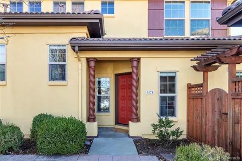 a front view of a building with potted plants