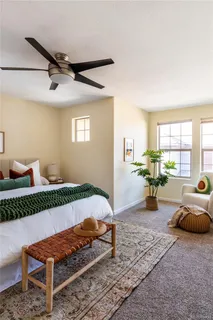 a bedroom with furniture and wooden floor