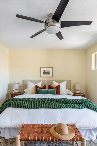 a bed room with a bed and a chair