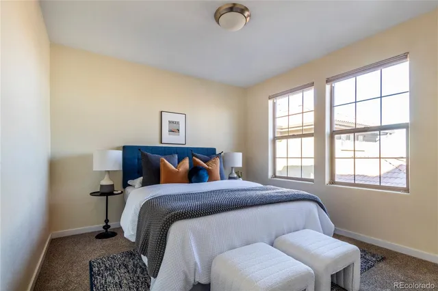 a bedroom with a bed and lamp