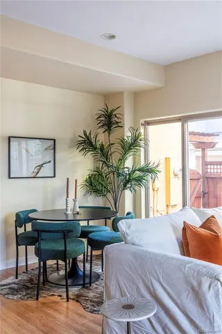 a bedroom with furniture and a potted plant