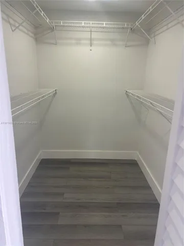 a bathroom with a sink vanity and mirror