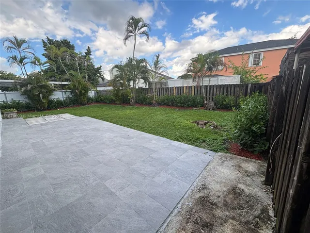 a house view with a garden space