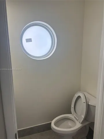 a bathroom with a toilet and a sink