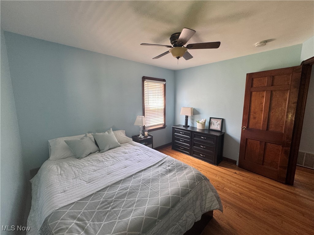 2809 Ralph Avenue Cleveland, OH 44109 - Photo 9 of 35 Bedroom with light hardwood floors and ceiling fan
