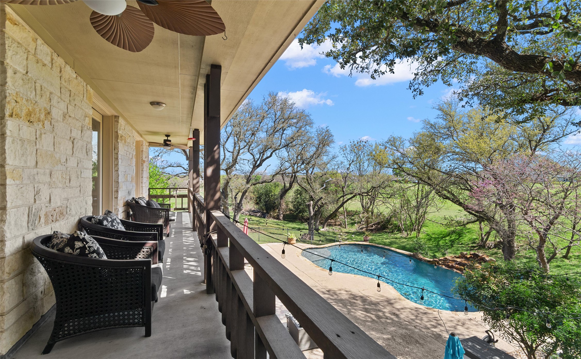 913 South Ridge Road Salado, TX 76571 - Photo 8 of 40 Main Level outdoor balcony looks over pool and views of golf course.