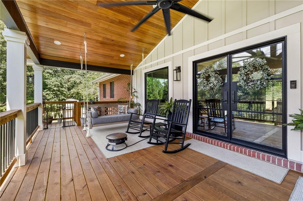 6470 Samoa Way Flowery Branch, GA 30542 - Photo 11 of 61 a view of a patio with wooden floor