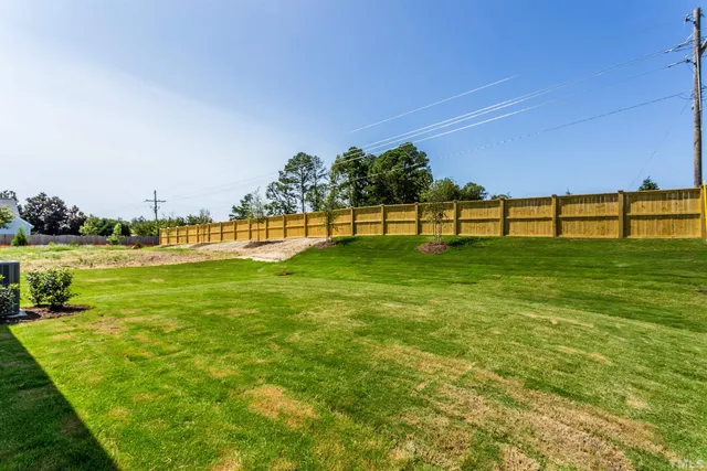 a view of a golf course with a lake view