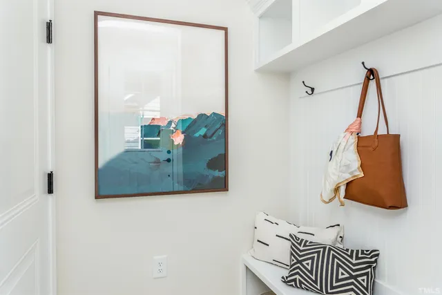 a view of a bedroom with furniture and a window