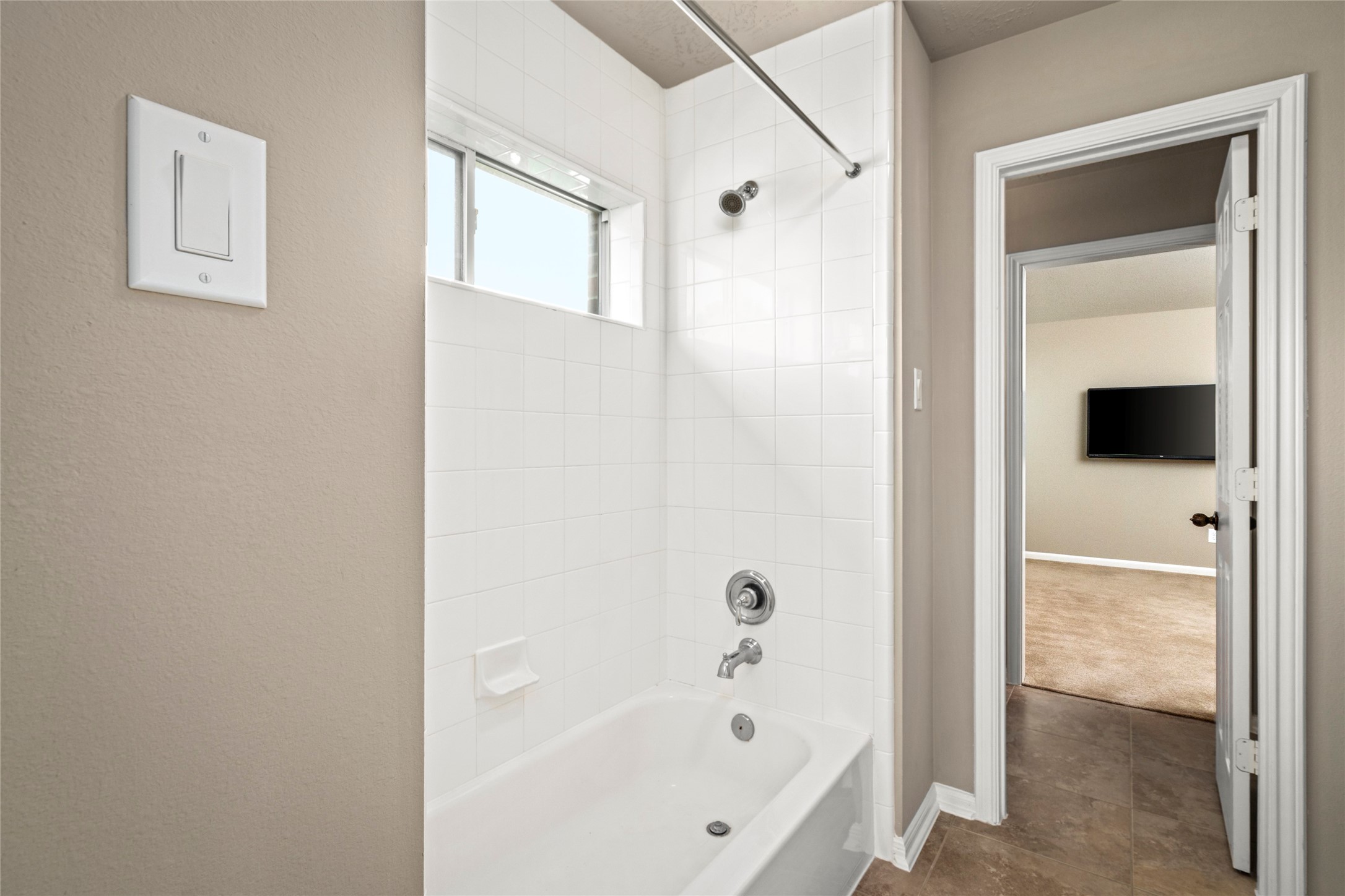 5307 Amber Sky Lane Rosharon, TX 77583 - Photo 40 of 50 A well-appointed secondary bath features a tub/shower combo and tile flooring, completing this thoughtfully designed upstairs layout.