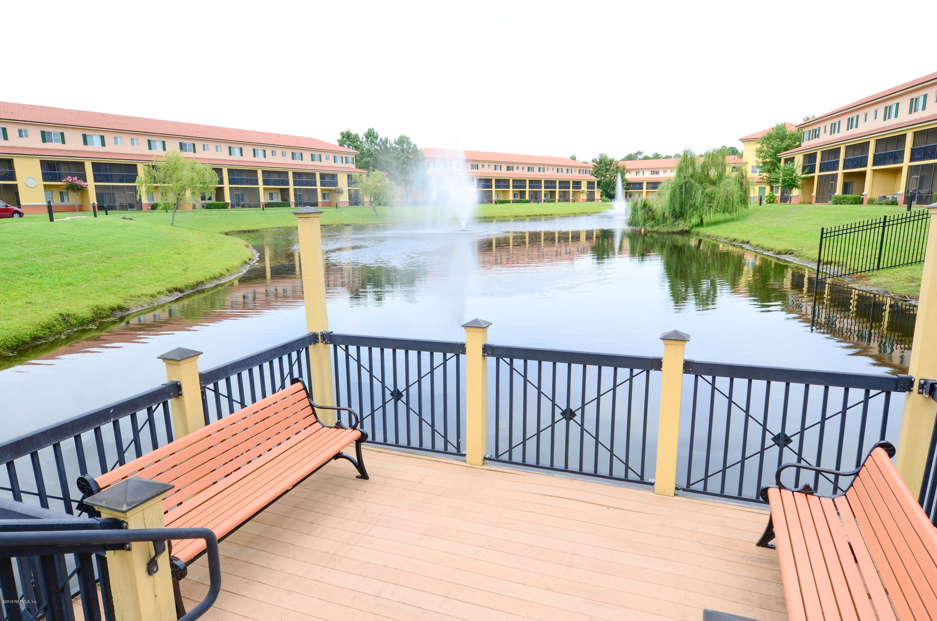 9745 Touchton Road, Unit 1829 Jacksonville, FL 32246 - Photo 29 of 37 a view of a balcony with wooden floor and outdoor space