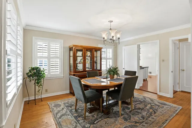 a view of a dining room with furniture and window