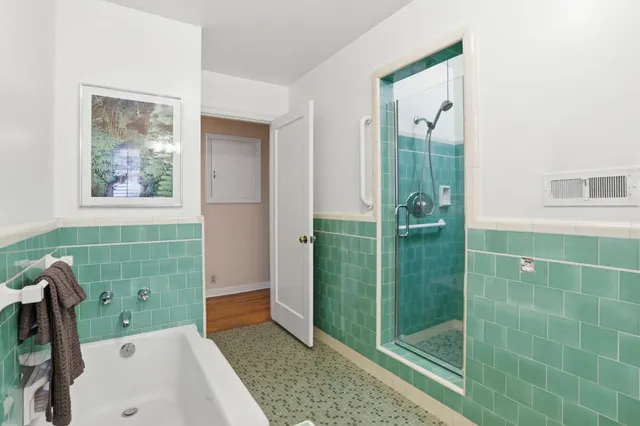 a bathroom with a sink and shower