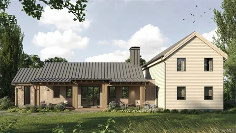 a front view of a house with a garden and plants