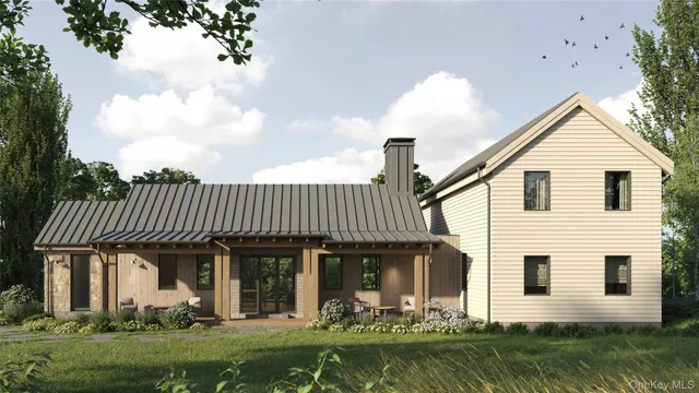 a front view of a house with a garden and plants