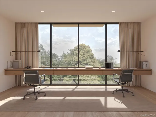 a living room with a large window and table