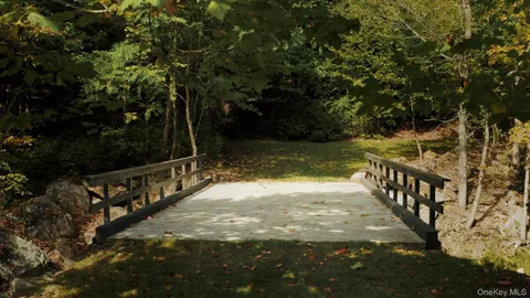 a front view of a house with garden and porch