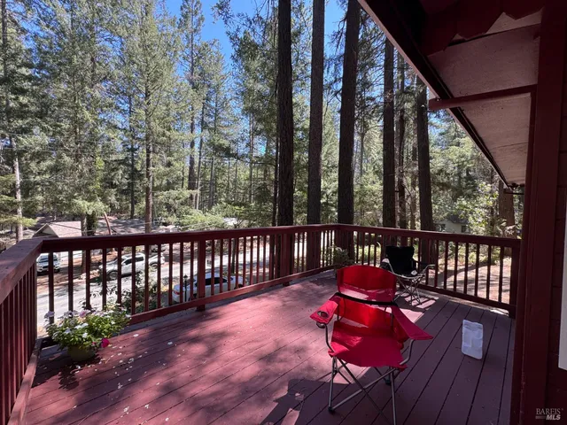 a view of a chairs on wooden deck
