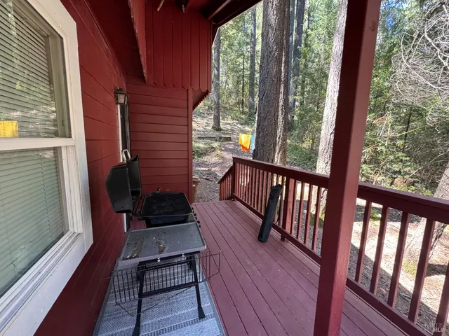 a view of a two chairs in the balcony