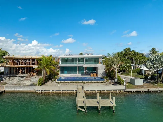 a swimming pool with outdoor seating and yard