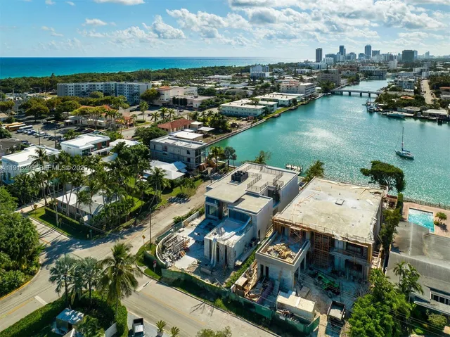 an aerial view of a house with lake view