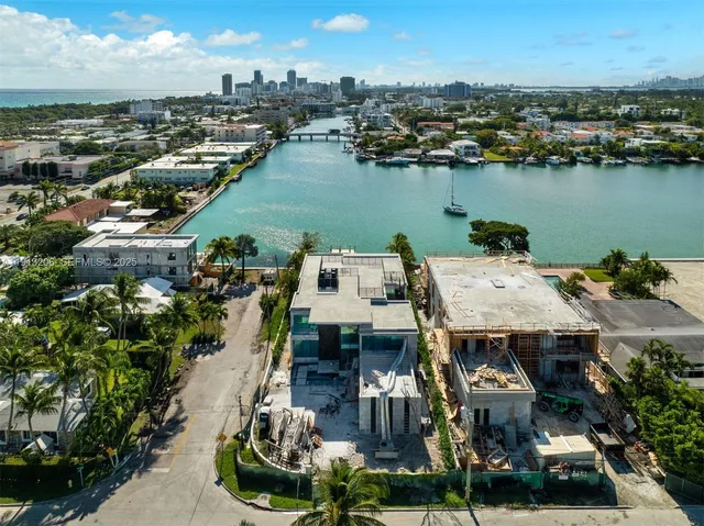 an aerial view of a house with a lake view