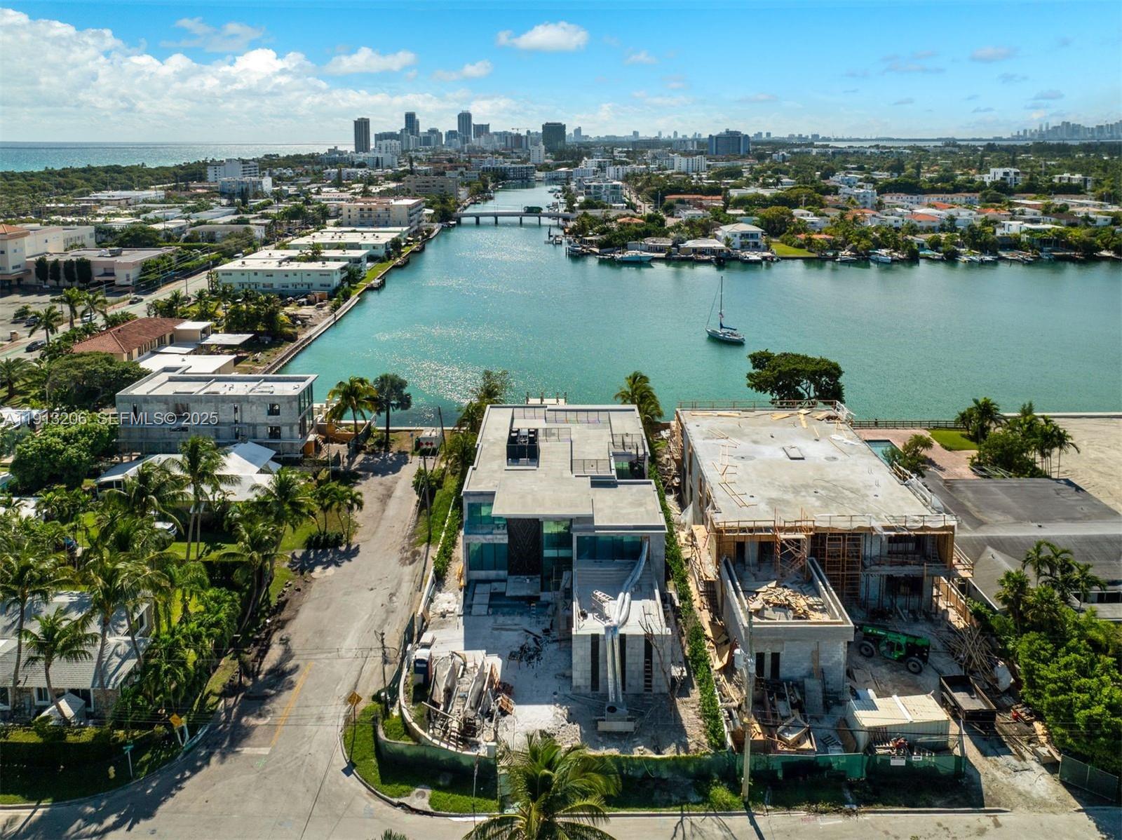 600 88th Street Surfside, FL 33154 - Photo 4 of 27 an aerial view of a house with a lake view