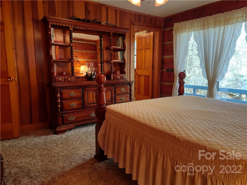 233 Nottingham Road Maggie Valley, NC 28751 - Photo 25 of 44 a bed sitting in a bedroom next to a window