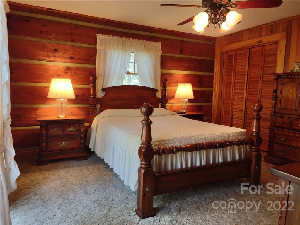 233 Nottingham Road Maggie Valley, NC 28751 - Photo 27 of 44 a bed room with a bed and a window