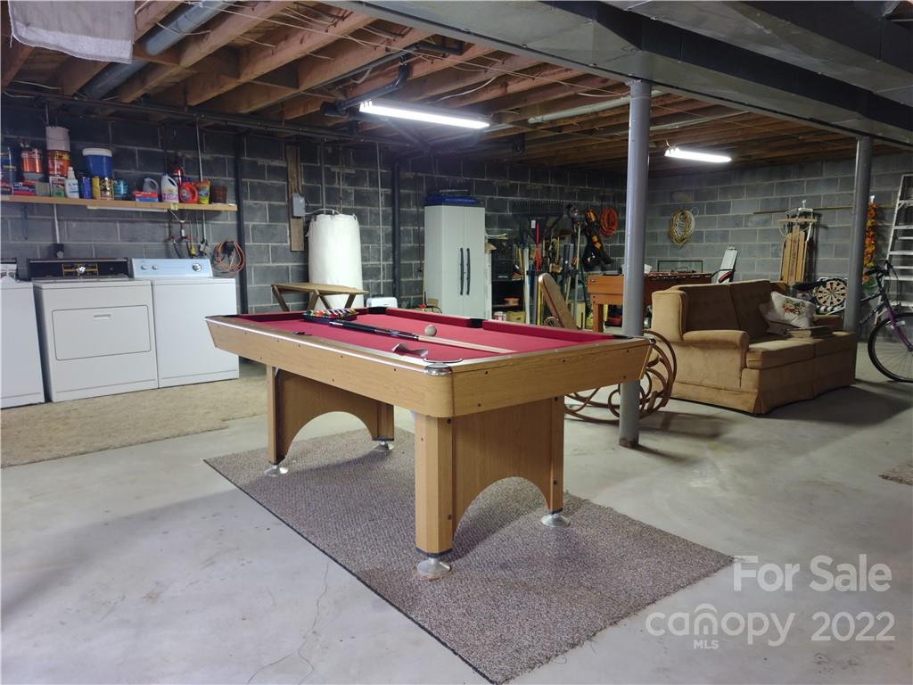 233 Nottingham Road Maggie Valley, NC 28751 - Photo 31 of 44 a room with lots of furniture and a table