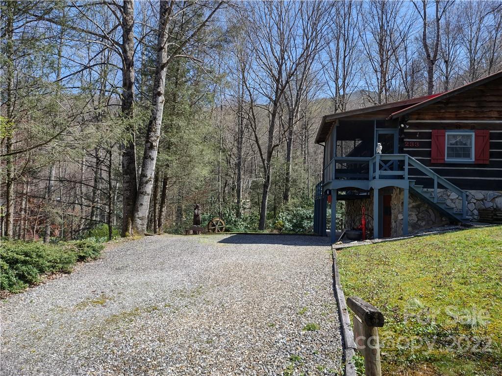 233 Nottingham Road Maggie Valley, NC 28751 - Photo 40 of 44 a view of a house with a yard