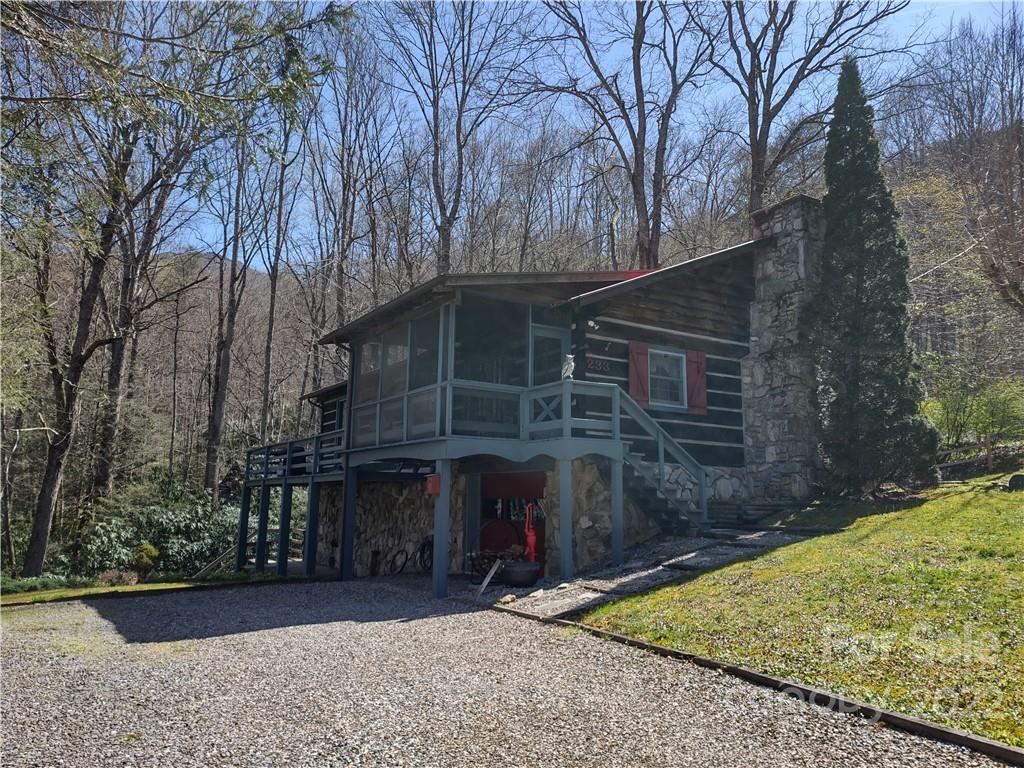 233 Nottingham Road Maggie Valley, NC 28751 - Photo 4 of 44 a view of a house with a yard