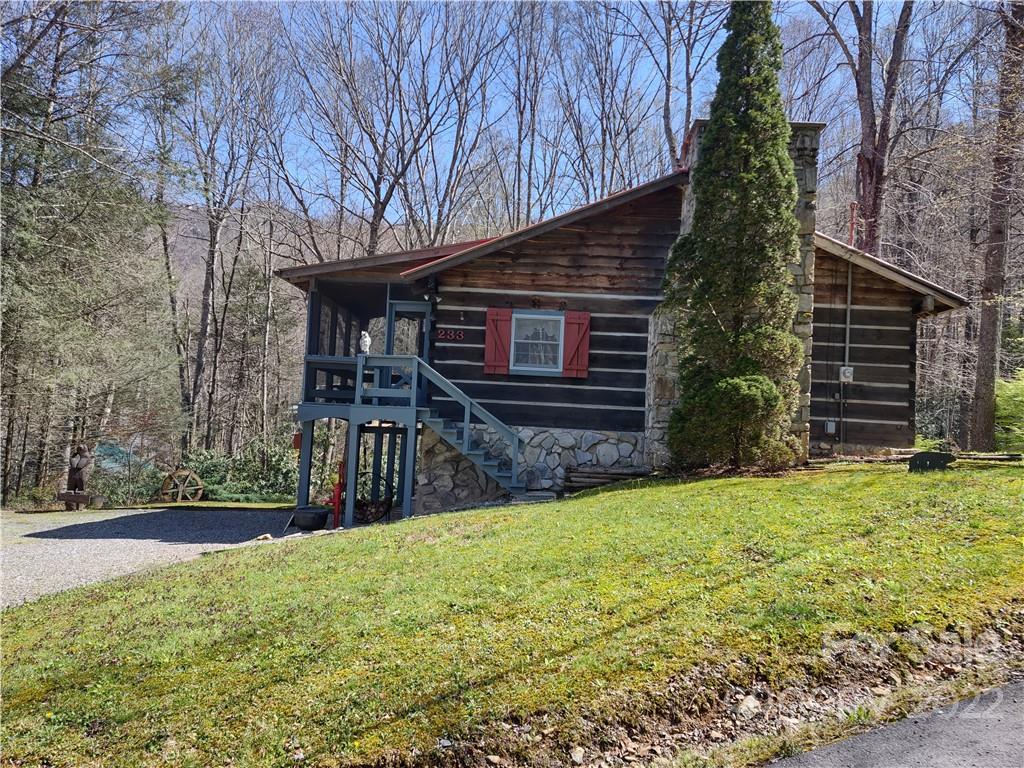 233 Nottingham Road Maggie Valley, NC 28751 - Photo 41 of 44 a view of a house with a yard