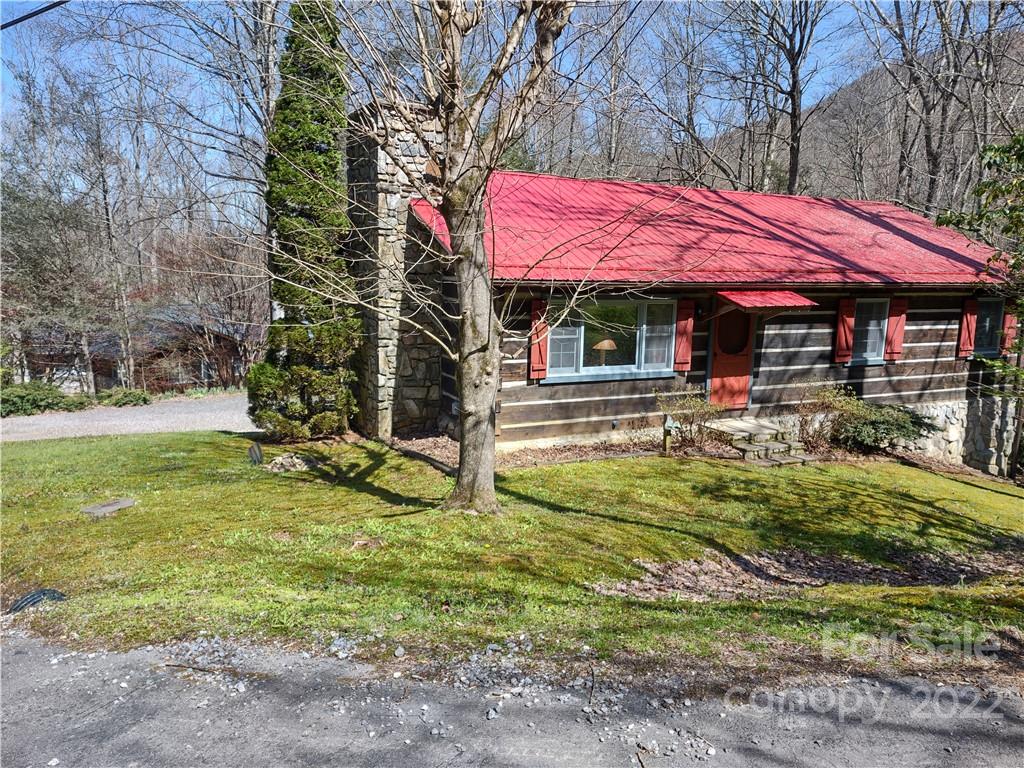 233 Nottingham Road Maggie Valley, NC 28751 - Photo 44 of 44 a view of a house with a yard