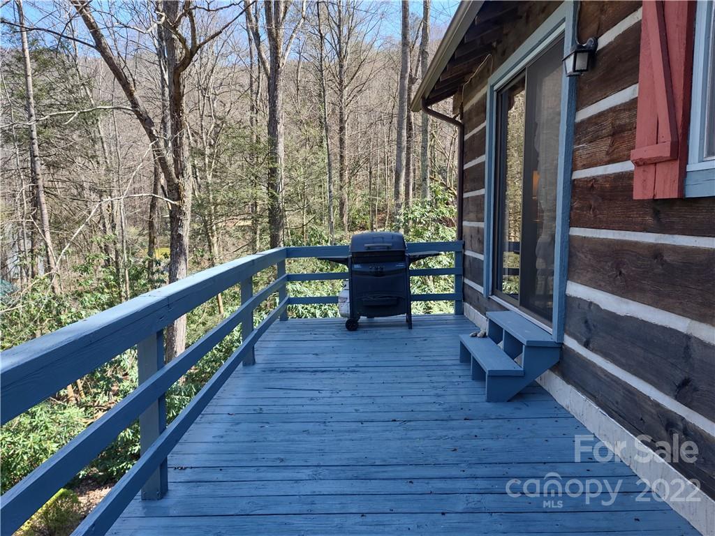 233 Nottingham Road Maggie Valley, NC 28751 - Photo 7 of 44 a balcony with wooden floor