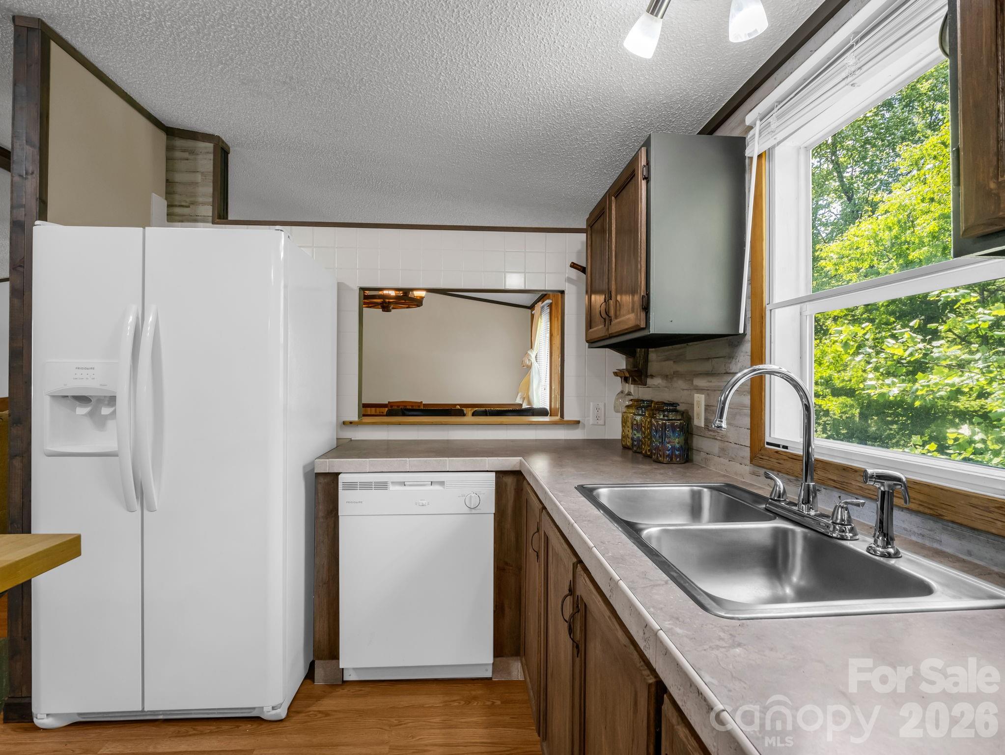 2053 Nancy Mountain Road Rosman, NC 28772 - Photo 20 of 47 a kitchen with a sink cabinets and a wooden floor