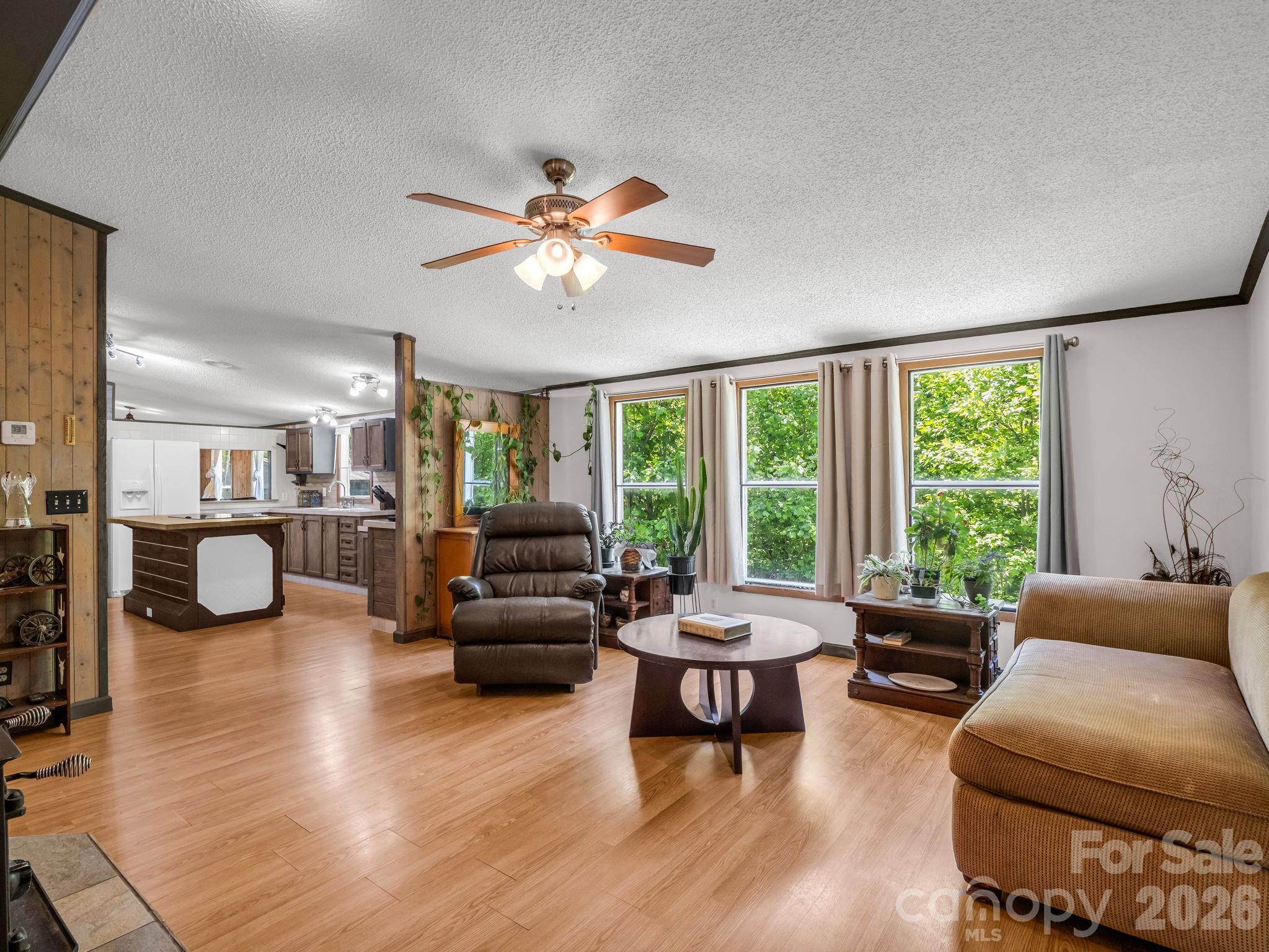 2053 Nancy Mountain Road Rosman, NC 28772 - Photo 23 of 47 a living room with furniture and a large window