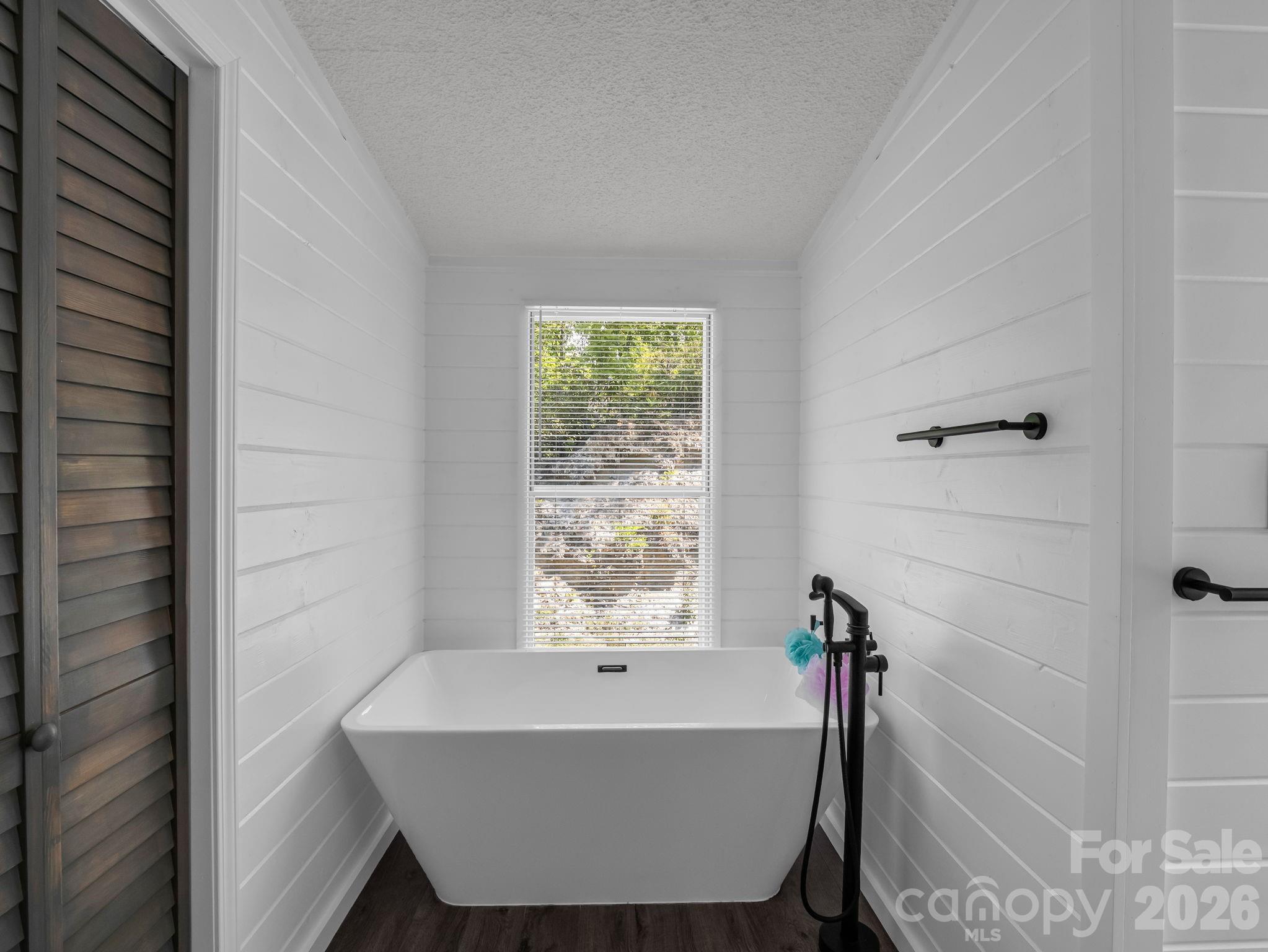 2053 Nancy Mountain Road Rosman, NC 28772 - Photo 28 of 47 a bathroom with a bathtub and shower