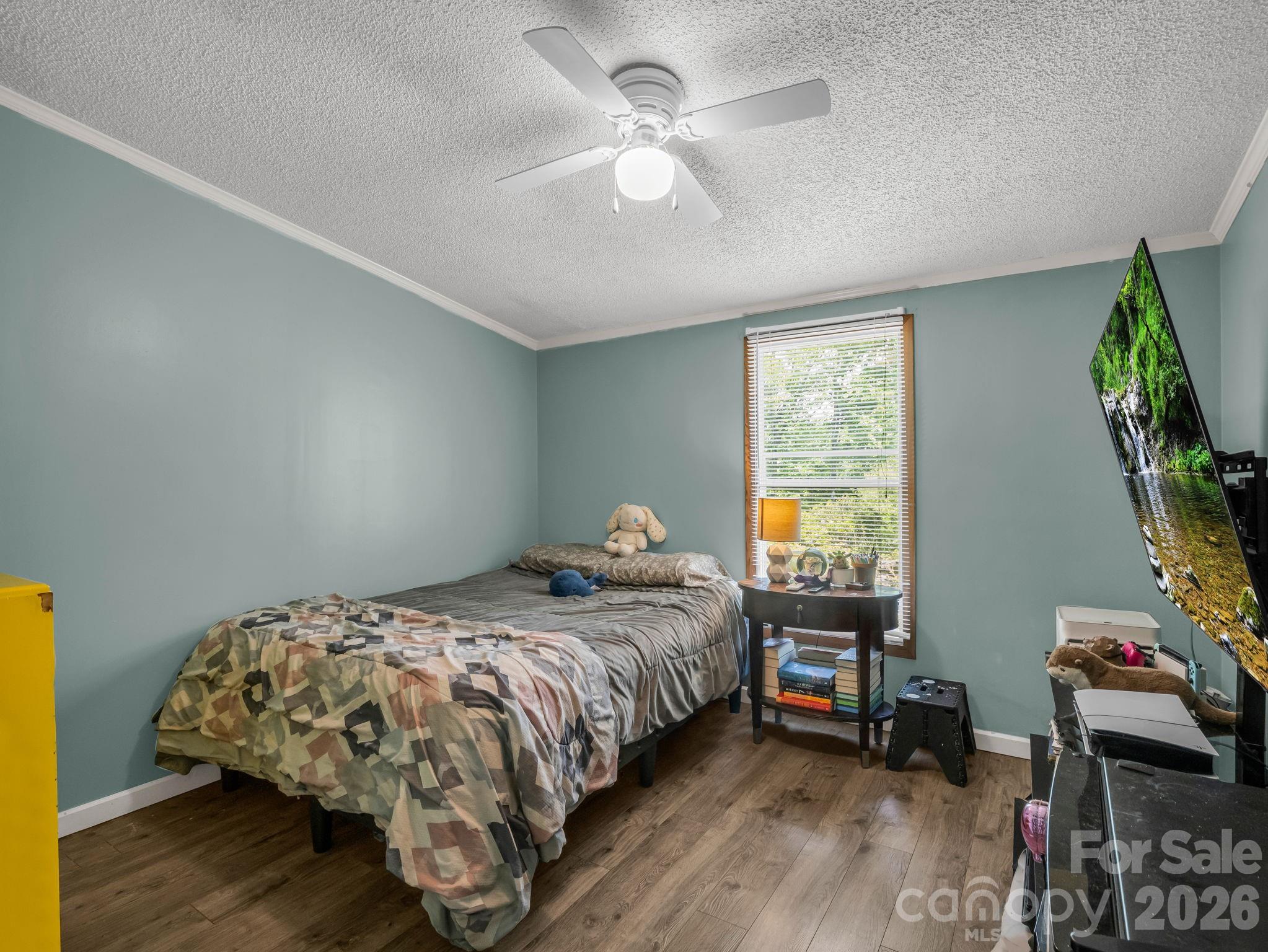 2053 Nancy Mountain Road Rosman, NC 28772 - Photo 31 of 47 a bedroom with a bed and a window