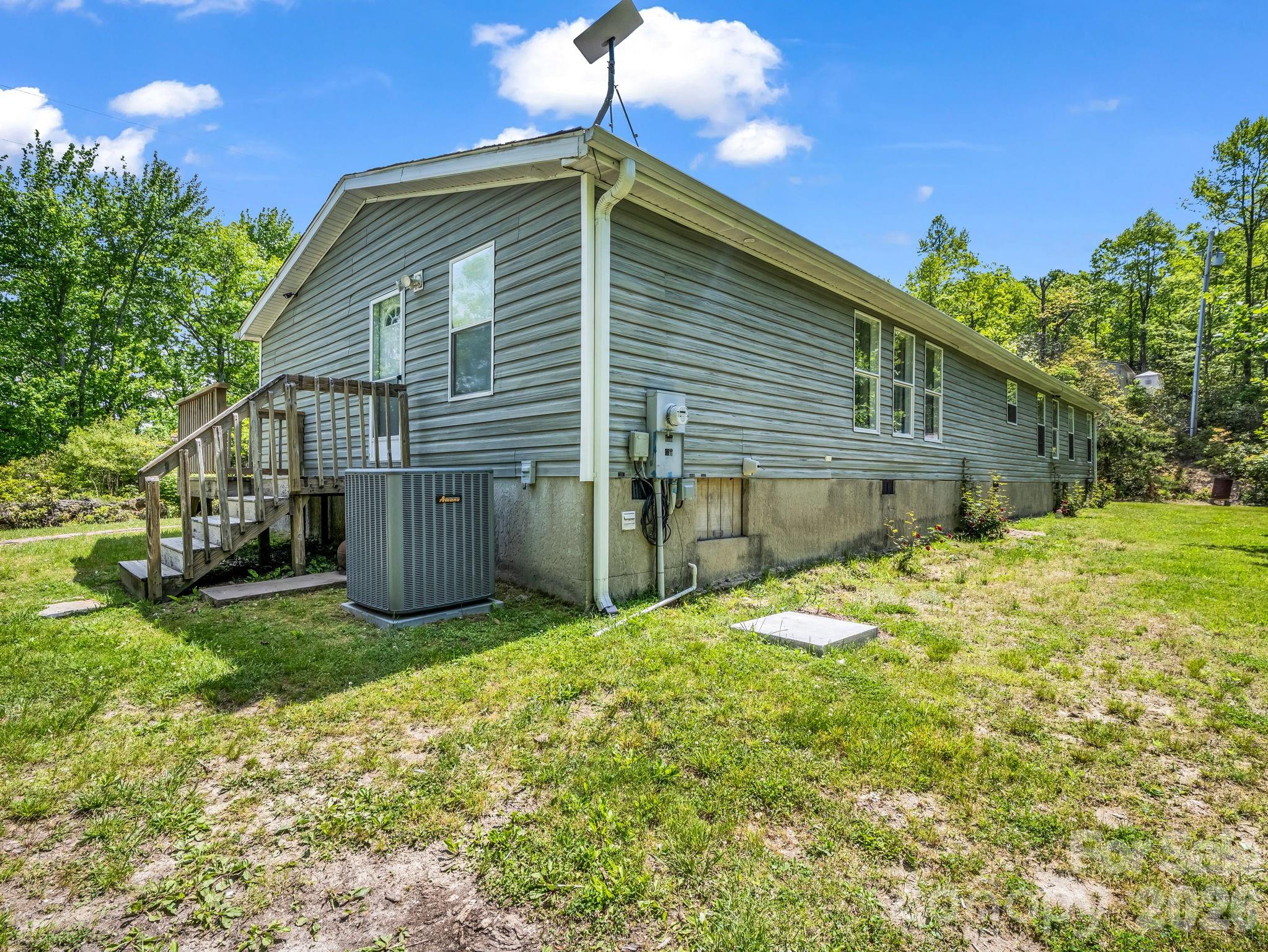 2053 Nancy Mountain Road Rosman, NC 28772 - Photo 5 of 47 a backyard of a house with table and chairs