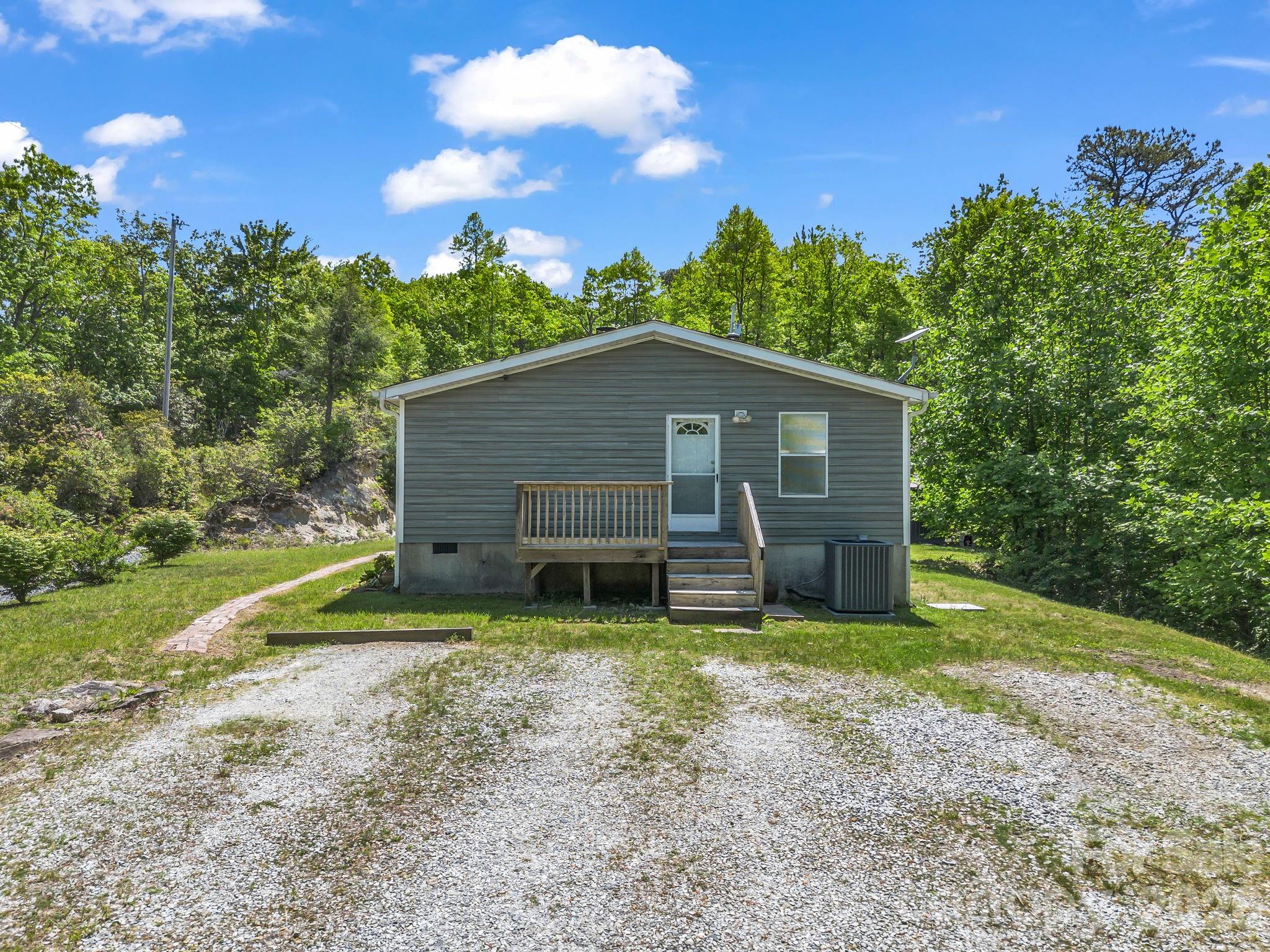 2053 Nancy Mountain Road Rosman, NC 28772 - Photo 6 of 47 a view of a house with backyard and trees