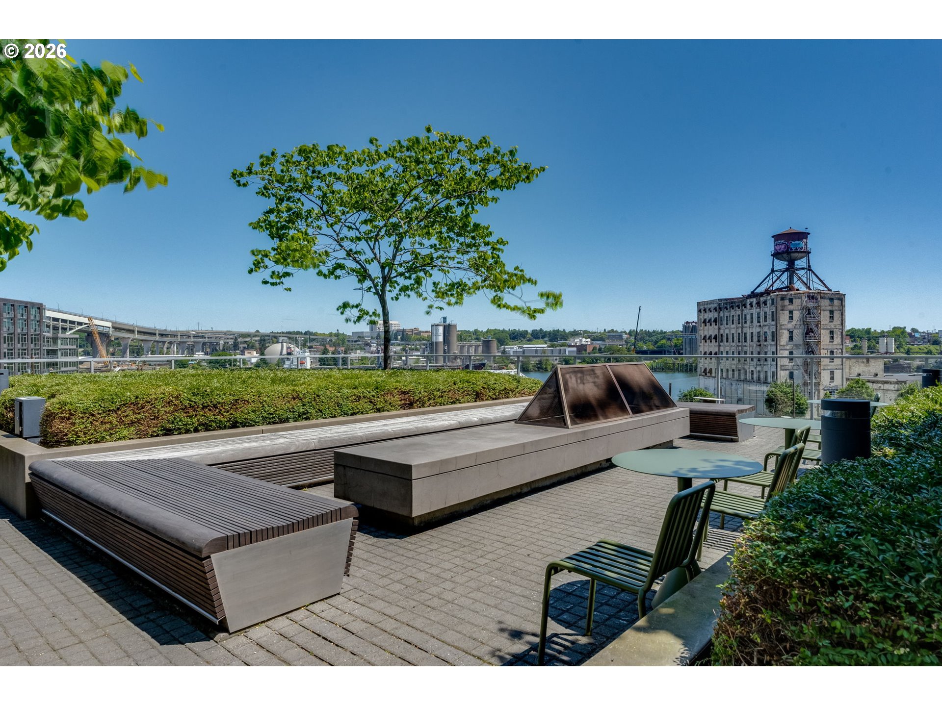1150 Northwest Quimby Street, Unit 406 Portland, OR 97209 - Photo 37 of 48 a view of swimming pool with outdoor seating and plants