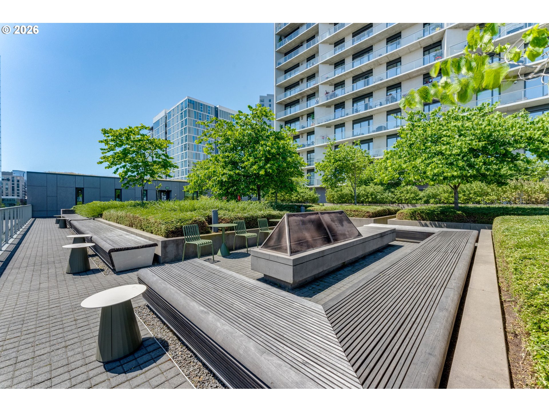 1150 Northwest Quimby Street, Unit 406 Portland, OR 97209 - Photo 38 of 48 a view of a chairs and table on the terrace