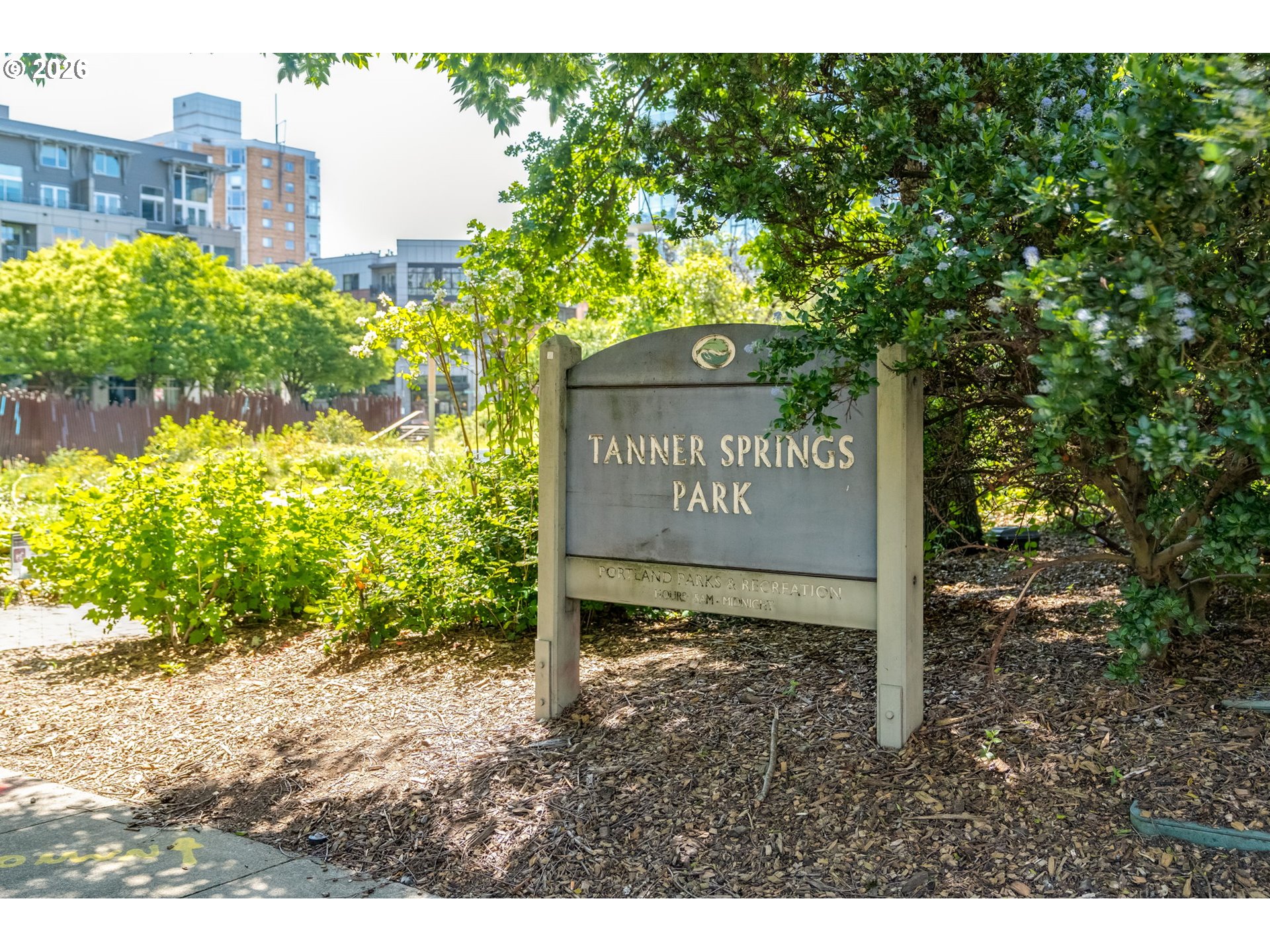 1150 Northwest Quimby Street, Unit 406 Portland, OR 97209 - Photo 45 of 48 a sign that is sitting in front of a building