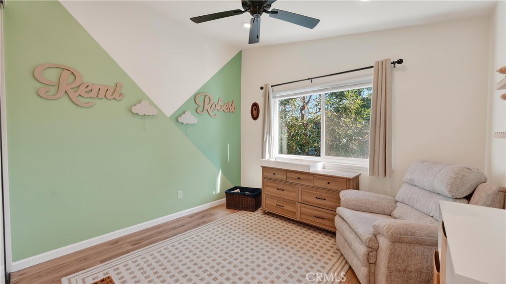 1761 Forum Way, Unit D Corona, CA 92881 - Photo 17 of 39 a living room with furniture and a window