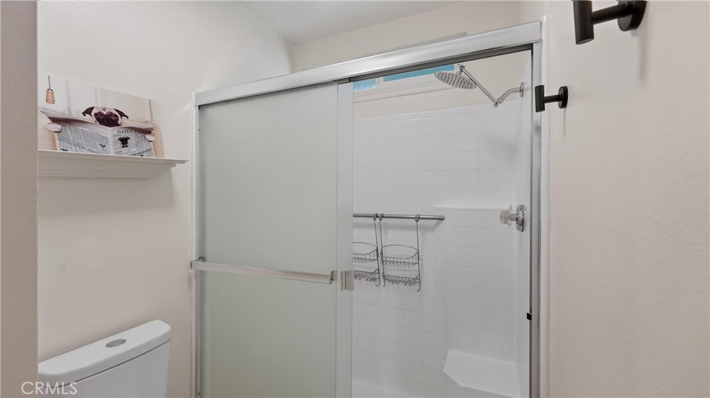 1761 Forum Way, Unit D Corona, CA 92881 - Photo 23 of 39 a bathroom with a shower toilet and sink